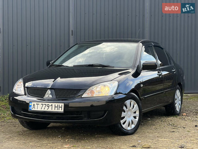 Чорний Міцубісі Lancer, об'ємом двигуна 1.58 л та пробігом 185 тис. км за 3750 $, фото 1 на Automoto.ua