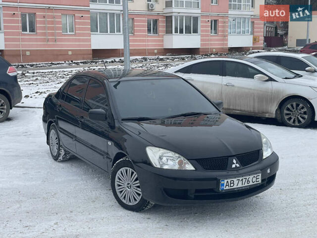 Чорний Міцубісі Lancer, об'ємом двигуна 1.58 л та пробігом 199 тис. км за 4400 $, фото 1 на Automoto.ua