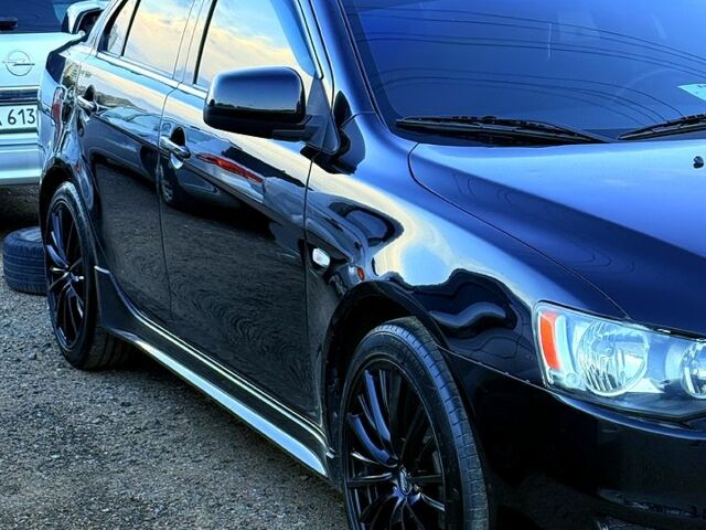 Чорний Міцубісі Lancer, об'ємом двигуна 2 л та пробігом 176 тис. км за 7500 $, фото 1 на Automoto.ua