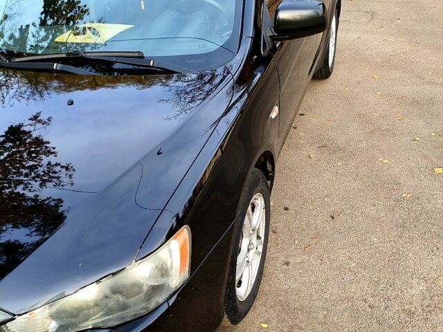 Черный Мицубиси Лансер, объемом двигателя 1.5 л и пробегом 207 тыс. км за 5500 $, фото 1 на Automoto.ua