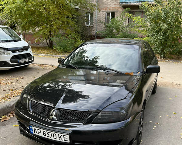 Чорний Міцубісі Lancer, об'ємом двигуна 1.58 л та пробігом 234 тис. км за 3800 $, фото 1 на Automoto.ua
