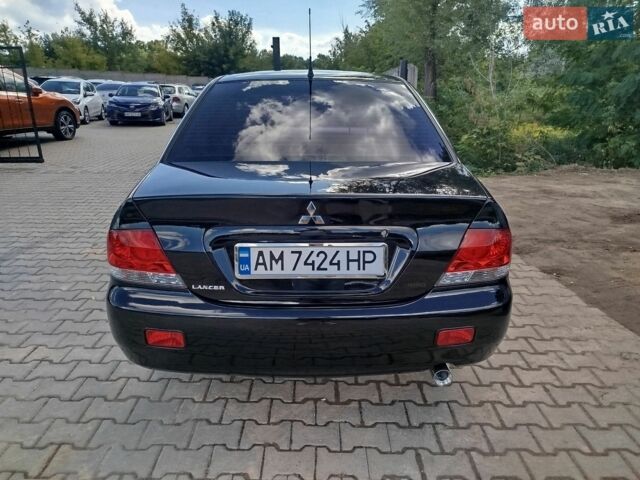 Чорний Міцубісі Lancer, об'ємом двигуна 1.6 л та пробігом 235 тис. км за 6250 $, фото 1 на Automoto.ua