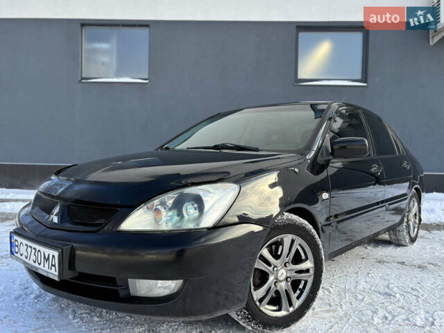 Черный Мицубиси Лансер, объемом двигателя 1.6 л и пробегом 145 тыс. км за 4200 $, фото 1 на Automoto.ua