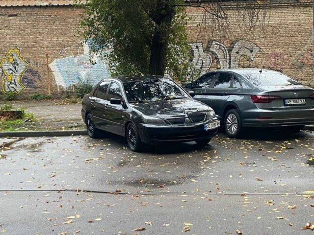 Черный Мицубиси Лансер, объемом двигателя 1.6 л и пробегом 253 тыс. км за 4700 $, фото 1 на Automoto.ua