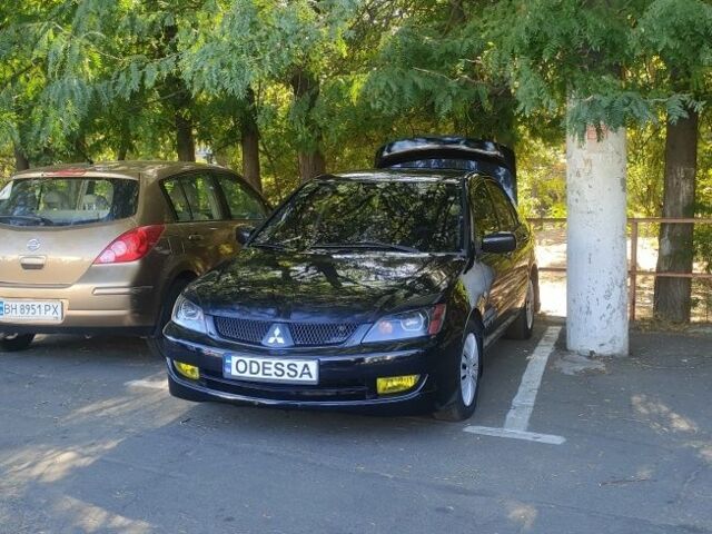 Чорний Міцубісі Lancer, об'ємом двигуна 1.6 л та пробігом 221 тис. км за 4700 $, фото 1 на Automoto.ua