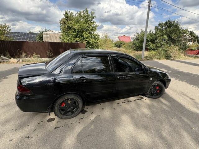 Чорний Міцубісі Lancer, об'ємом двигуна 1.6 л та пробігом 244 тис. км за 4999 $, фото 1 на Automoto.ua