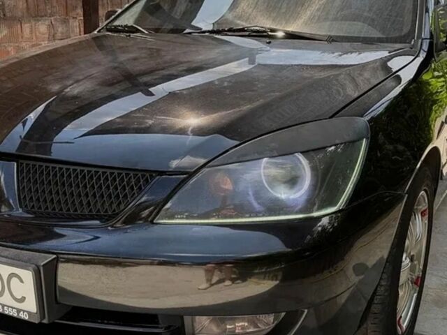 Чорний Міцубісі Lancer, об'ємом двигуна 1.6 л та пробігом 240 тис. км за 4004 $, фото 1 на Automoto.ua