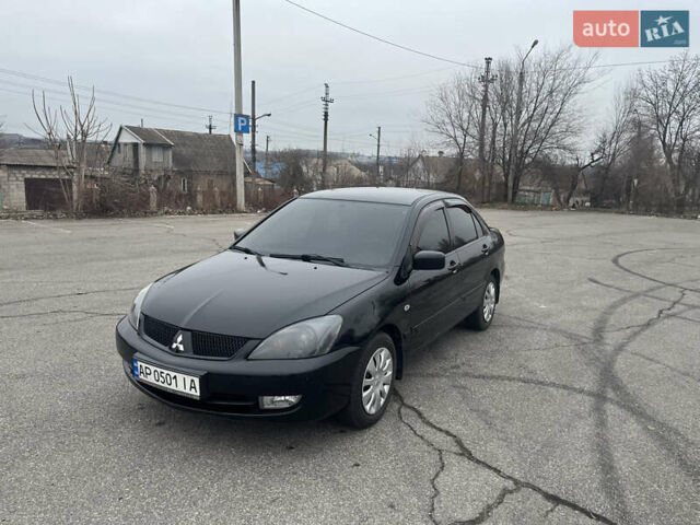 Чорний Міцубісі Lancer, об'ємом двигуна 1.58 л та пробігом 173 тис. км за 5099 $, фото 1 на Automoto.ua