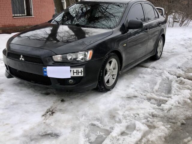Черный Мицубиси Лансер, объемом двигателя 2 л и пробегом 290 тыс. км за 3900 $, фото 1 на Automoto.ua