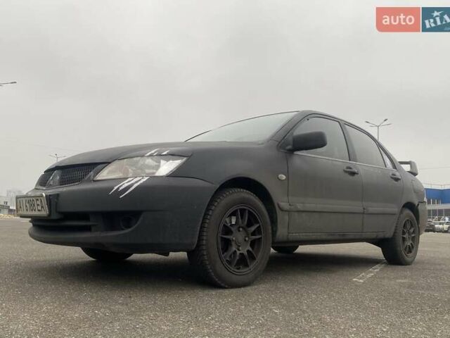 Черный Мицубиси Лансер, объемом двигателя 1.58 л и пробегом 263 тыс. км за 4000 $, фото 1 на Automoto.ua