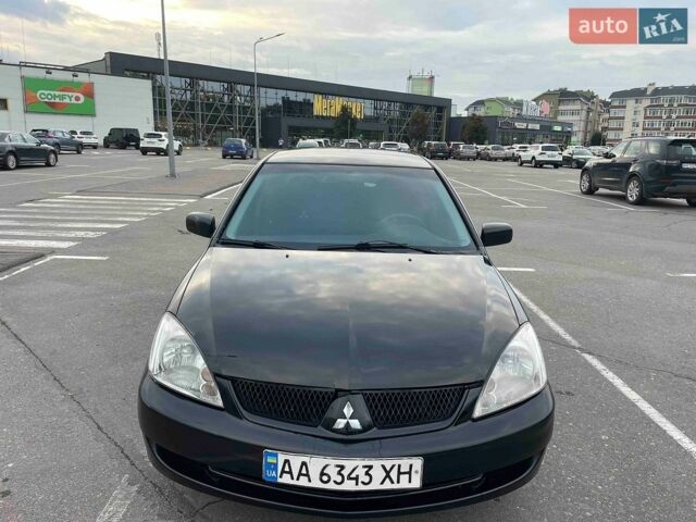 Чорний Міцубісі Lancer, об'ємом двигуна 1.58 л та пробігом 292 тис. км за 2900 $, фото 1 на Automoto.ua