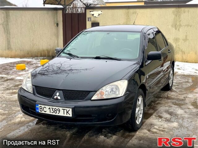 Черный Мицубиси Лансер, объемом двигателя 1.6 л и пробегом 180 тыс. км за 3800 $, фото 1 на Automoto.ua