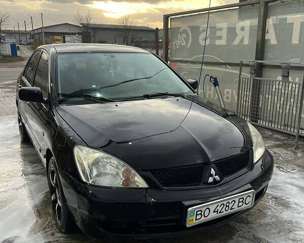 Черный Мицубиси Лансер, объемом двигателя 1.6 л и пробегом 180 тыс. км за 3499 $, фото 1 на Automoto.ua