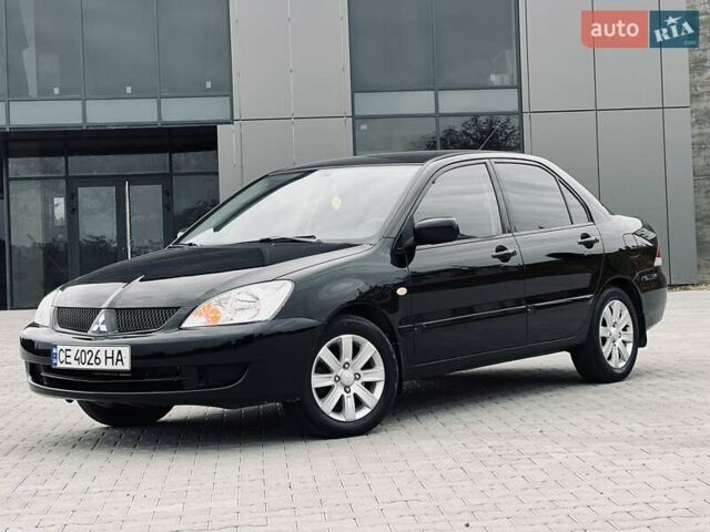 Чорний Міцубісі Lancer, об'ємом двигуна 1.6 л та пробігом 243 тис. км за 4950 $, фото 1 на Automoto.ua