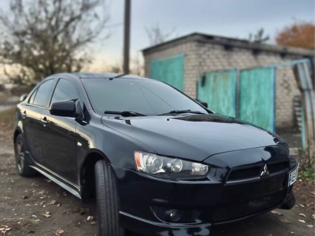 Черный Мицубиси Лансер, объемом двигателя 2 л и пробегом 170 тыс. км за 7000 $, фото 1 на Automoto.ua