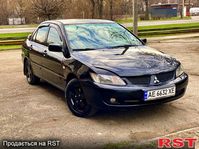Черный Мицубиси Лансер, объемом двигателя 1.6 л и пробегом 197 тыс. км за 3950 $, фото 1 на Automoto.ua