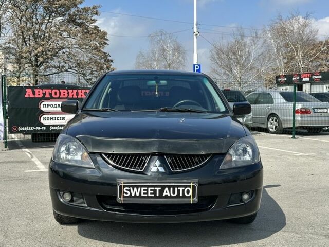 Чорний Міцубісі Lancer, об'ємом двигуна 1.6 л та пробігом 226 тис. км за 3899 $, фото 1 на Automoto.ua