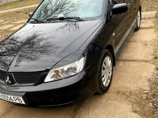 Чорний Міцубісі Lancer, об'ємом двигуна 1.6 л та пробігом 222 тис. км за 4000 $, фото 1 на Automoto.ua