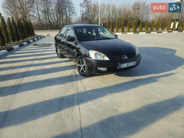 Чорний Міцубісі Lancer, об'ємом двигуна 1.59 л та пробігом 180 тис. км за 4999 $, фото 1 на Automoto.ua
