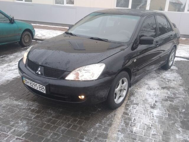 Черный Мицубиси Лансер, объемом двигателя 1 л и пробегом 2 тыс. км за 2700 $, фото 1 на Automoto.ua