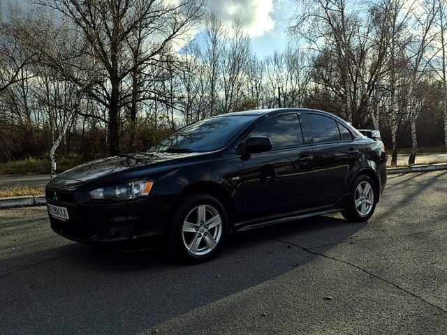 Черный Мицубиси Лансер, объемом двигателя 2 л и пробегом 224 тыс. км за 7000 $, фото 1 на Automoto.ua