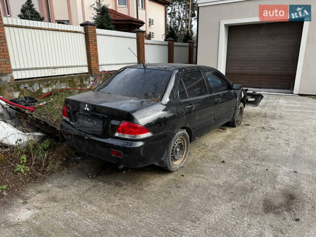Черный Мицубиси Лансер, объемом двигателя 1.58 л и пробегом 160 тыс. км за 1299 $, фото 1 на Automoto.ua