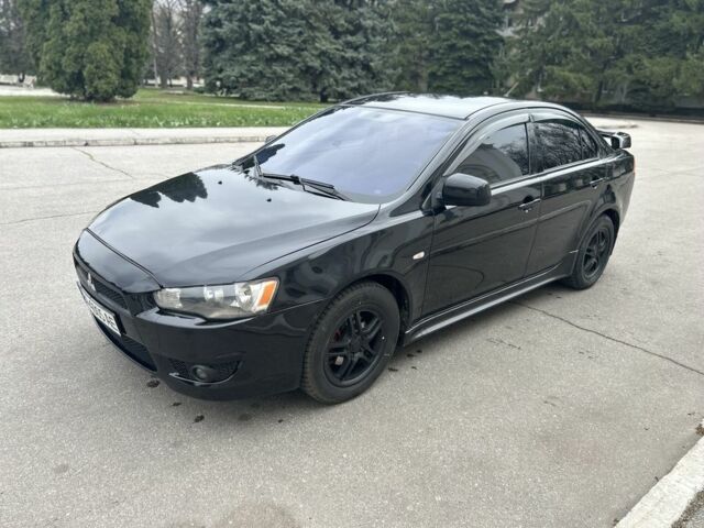 Черный Мицубиси Лансер, объемом двигателя 2 л и пробегом 196 тыс. км за 6300 $, фото 1 на Automoto.ua