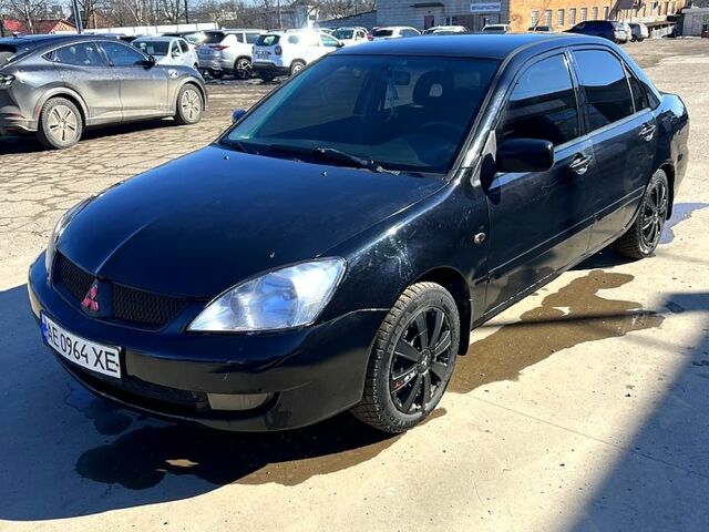 Черный Мицубиси Лансер, объемом двигателя 1.6 л и пробегом 260 тыс. км за 4250 $, фото 1 на Automoto.ua