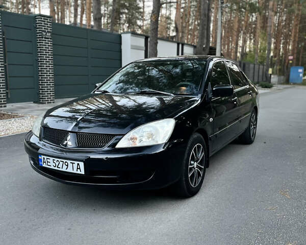 Чорний Міцубісі Lancer, об'ємом двигуна 1.58 л та пробігом 278 тис. км за 4800 $, фото 1 на Automoto.ua