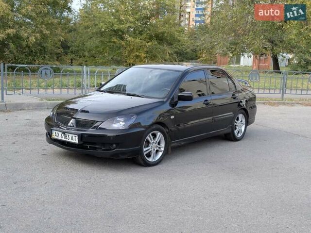 Чорний Міцубісі Lancer, об'ємом двигуна 2 л та пробігом 152 тис. км за 5500 $, фото 1 на Automoto.ua
