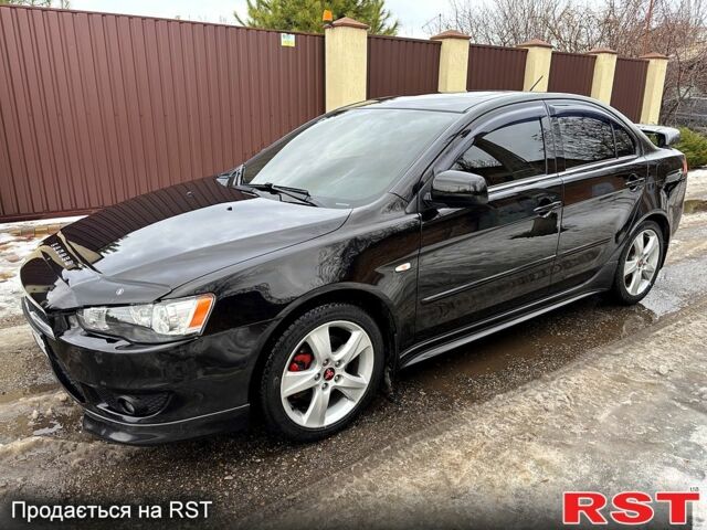 Чорний Міцубісі Lancer, об'ємом двигуна 2 л та пробігом 18800 тис. км за 6300 $, фото 1 на Automoto.ua