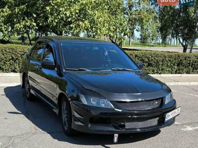 Чорний Міцубісі Lancer, об'ємом двигуна 2 л та пробігом 161 тис. км за 4300 $, фото 1 на Automoto.ua