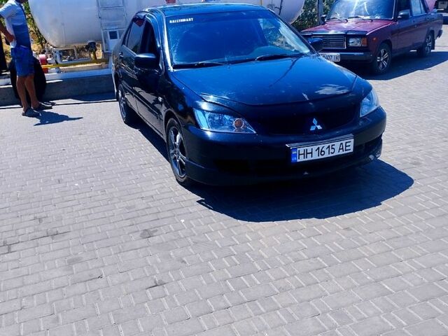 Черный Мицубиси Лансер, объемом двигателя 2 л и пробегом 168 тыс. км за 3800 $, фото 1 на Automoto.ua