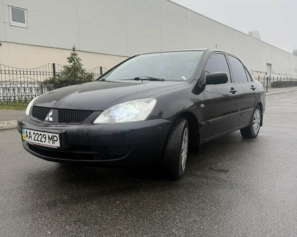 Чорний Міцубісі Lancer, об'ємом двигуна 1.58 л та пробігом 256 тис. км за 3700 $, фото 1 на Automoto.ua