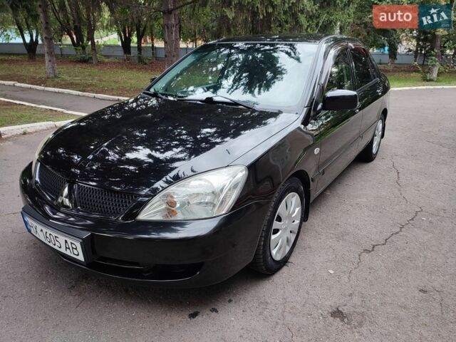 Чорний Міцубісі Lancer, об'ємом двигуна 1.58 л та пробігом 137 тис. км за 4699 $, фото 1 на Automoto.ua