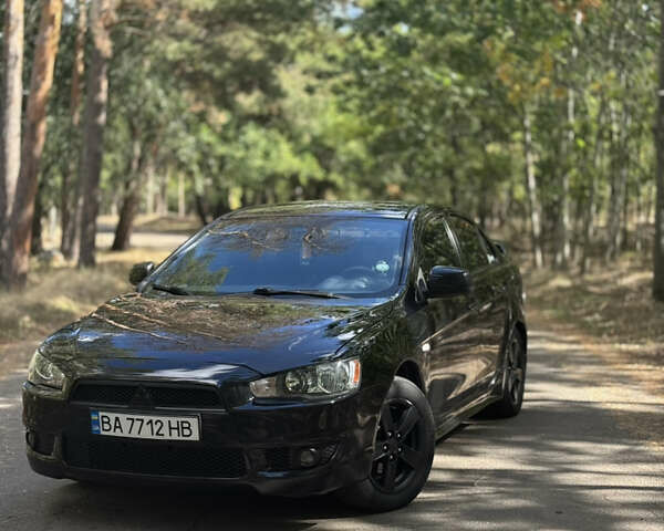 Черный Мицубиси Лансер, объемом двигателя 2 л и пробегом 245 тыс. км за 6800 $, фото 1 на Automoto.ua