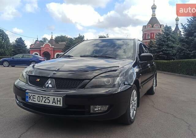 Черный Мицубиси Лансер, объемом двигателя 1.6 л и пробегом 345 тыс. км за 4800 $, фото 1 на Automoto.ua
