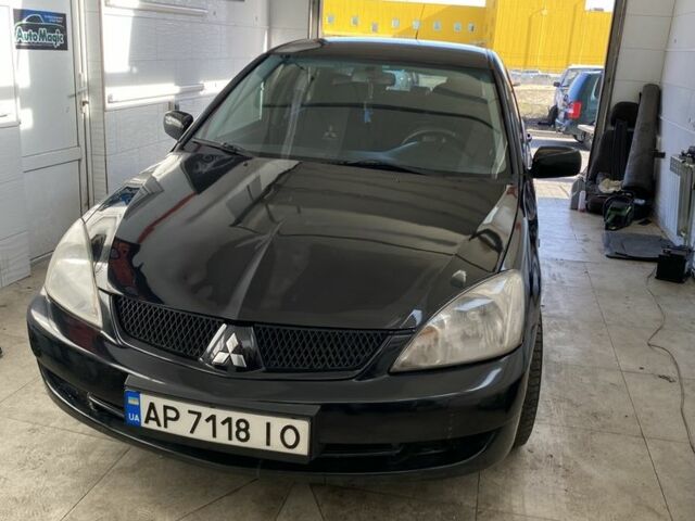 Черный Мицубиси Лансер, объемом двигателя 1.6 л и пробегом 260 тыс. км за 2500 $, фото 1 на Automoto.ua