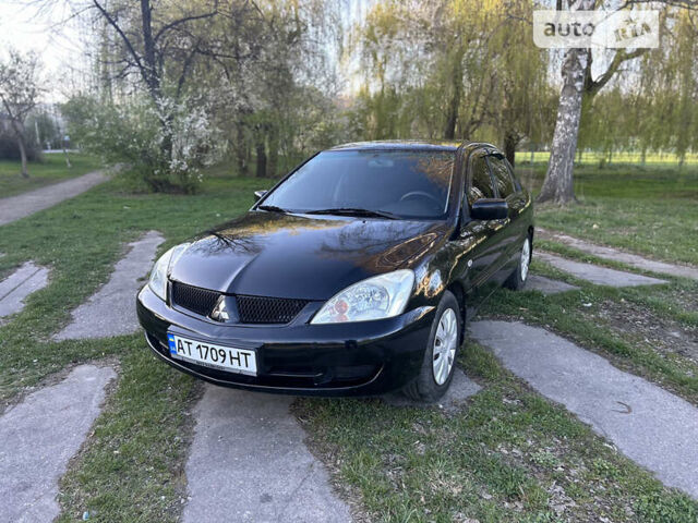 Чорний Міцубісі Lancer, об'ємом двигуна 1.58 л та пробігом 161 тис. км за 5300 $, фото 1 на Automoto.ua