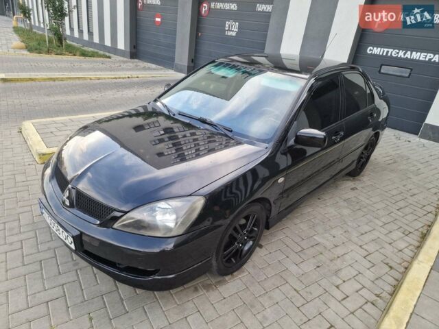 Чорний Міцубісі Lancer, об'ємом двигуна 2 л та пробігом 272 тис. км за 4450 $, фото 1 на Automoto.ua
