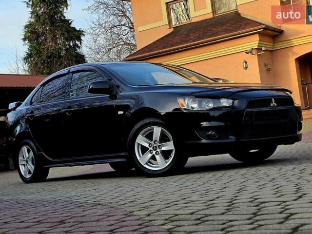 Чорний Міцубісі Lancer, об'ємом двигуна 2 л та пробігом 260 тис. км за 6555 $, фото 1 на Automoto.ua