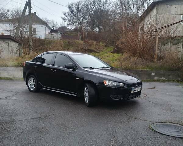Черный Мицубиси Лансер, объемом двигателя 2 л и пробегом 116 тыс. км за 7200 $, фото 1 на Automoto.ua