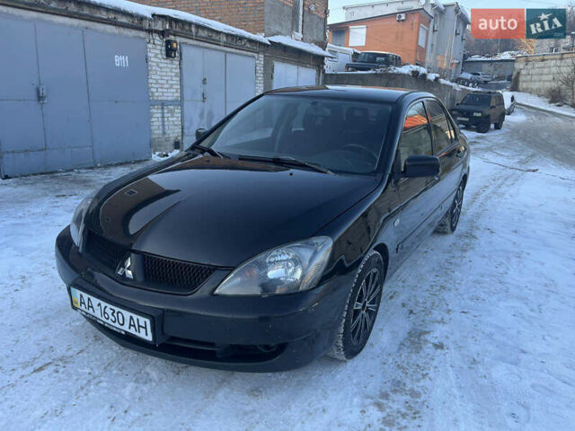 Черный Мицубиси Лансер, объемом двигателя 2 л и пробегом 303 тыс. км за 4000 $, фото 1 на Automoto.ua