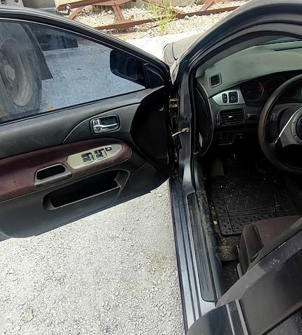 Чорний Міцубісі Lancer, об'ємом двигуна 2 л та пробігом 200 тис. км за 1800 $, фото 1 на Automoto.ua