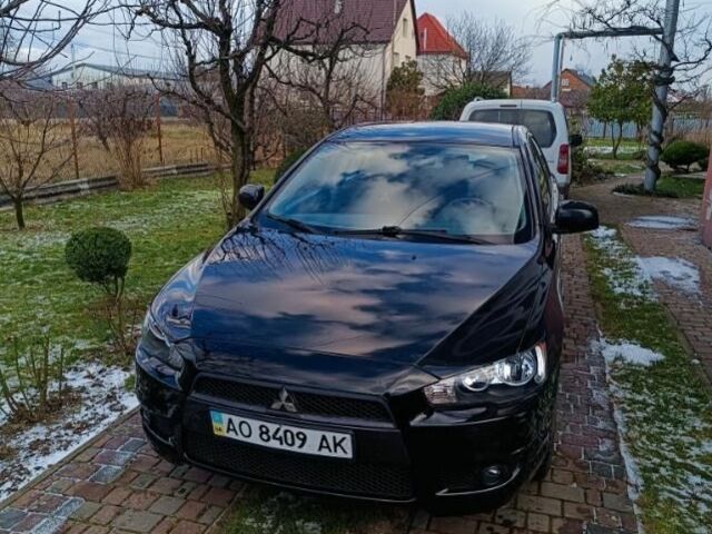 Черный Мицубиси Лансер, объемом двигателя 2 л и пробегом 236 тыс. км за 6100 $, фото 1 на Automoto.ua