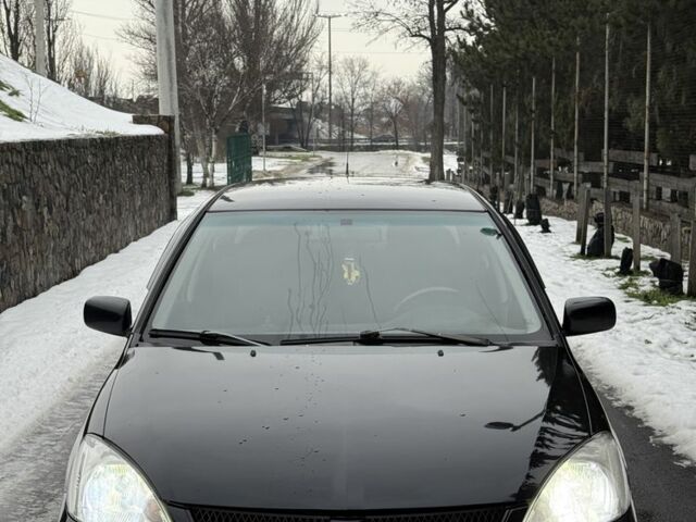 Чорний Міцубісі Lancer, об'ємом двигуна 1.6 л та пробігом 199 тис. км за 4199 $, фото 1 на Automoto.ua