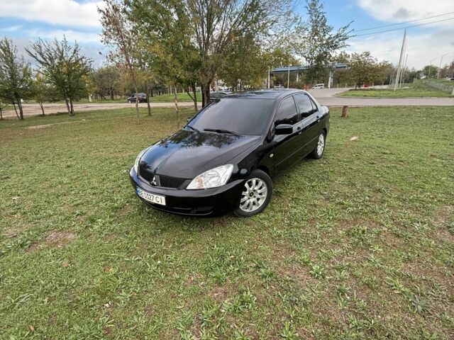 Чорний Міцубісі Lancer, об'ємом двигуна 1.6 л та пробігом 280 тис. км за 4088 $, фото 1 на Automoto.ua