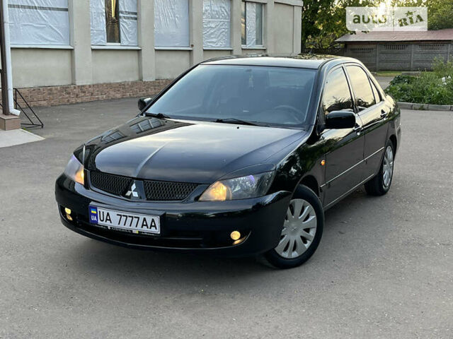 Чорний Міцубісі Lancer, об'ємом двигуна 1.58 л та пробігом 161 тис. км за 4500 $, фото 1 на Automoto.ua