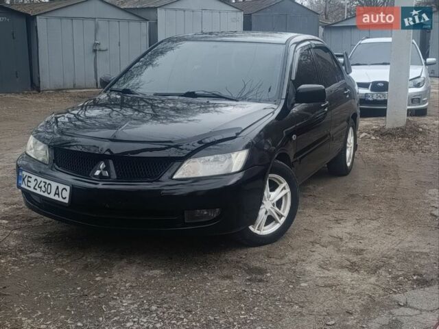Черный Мицубиси Лансер, объемом двигателя 1.6 л и пробегом 240 тыс. км за 3450 $, фото 1 на Automoto.ua