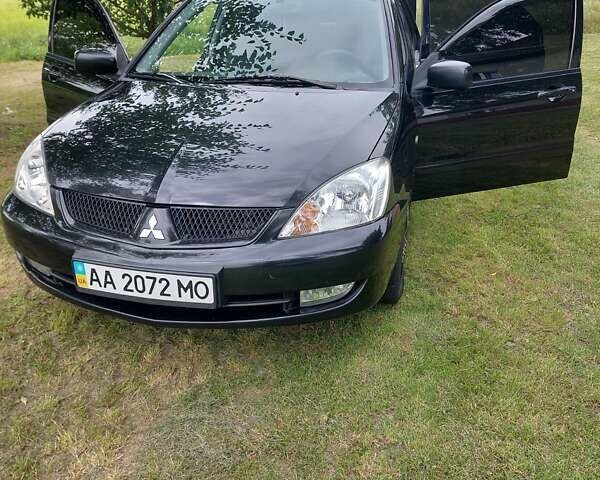 Черный Мицубиси Лансер, объемом двигателя 1.6 л и пробегом 210 тыс. км за 5500 $, фото 1 на Automoto.ua